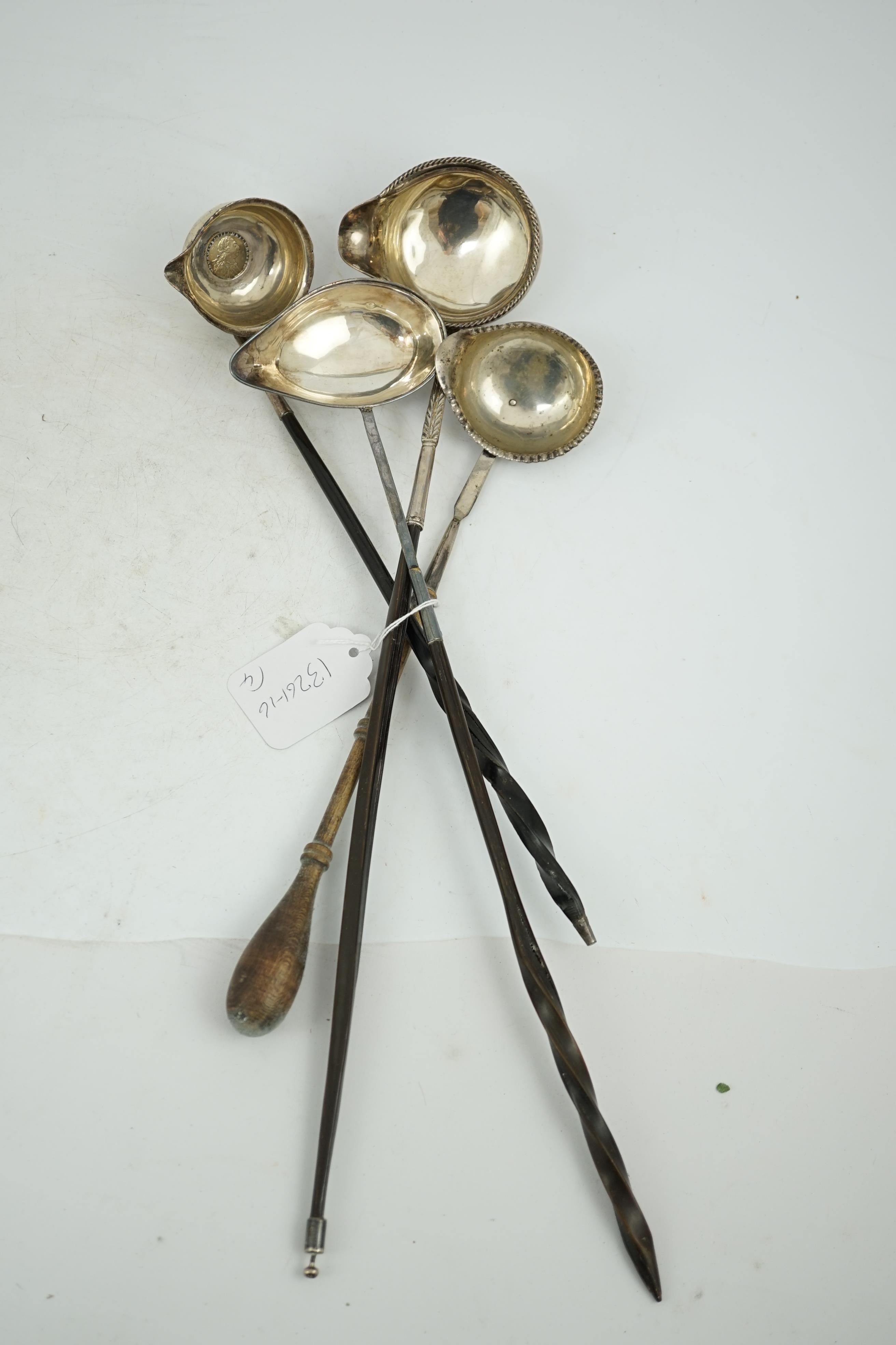 A Georgian silver toddy ladle, makers mark stamped four times (rubbed), 43cm and three other unmarked toddy ladles.